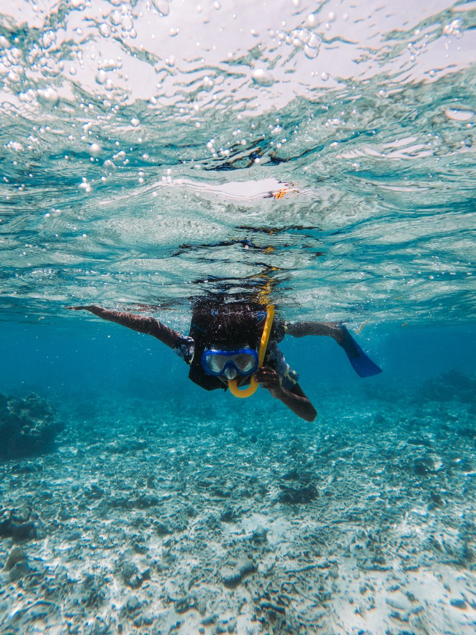 Snorkeling in the clear waters near Cala Figuera